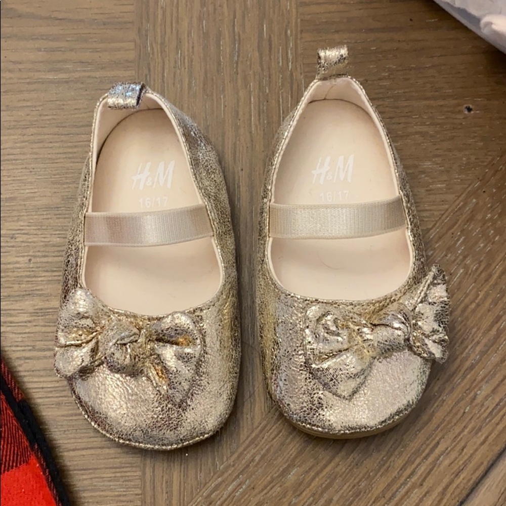 Gold baby shoes